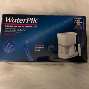 WaterPik flosser new in box never used. Box flawed